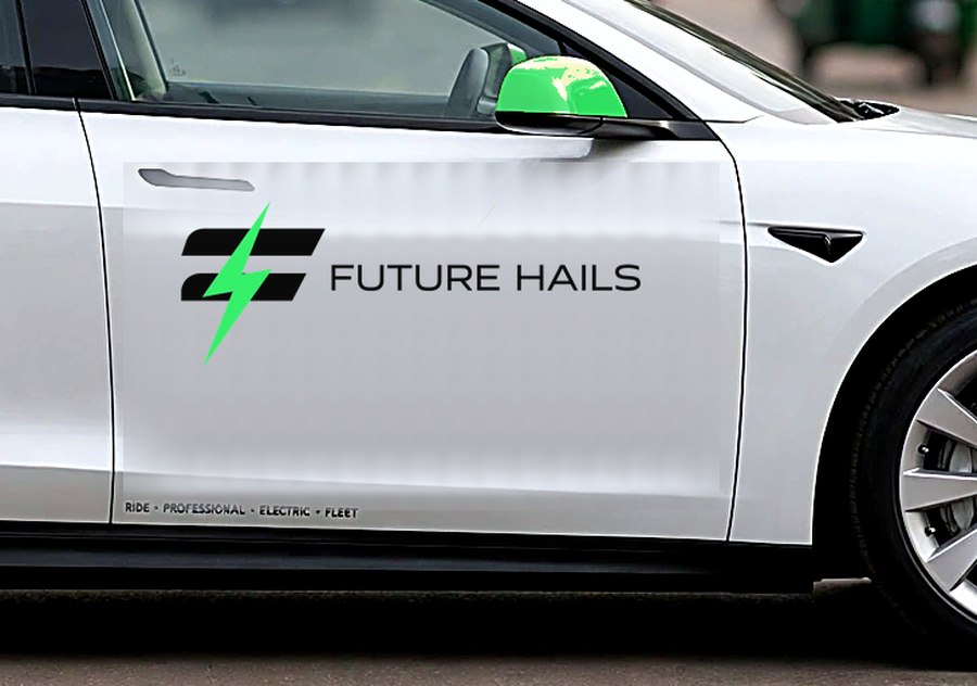 The Future Hails badge on the door of a white electric car, lime sill light reflected in wet tarmac
